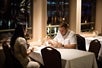 A couple looking over the menu while on the Dinner Cruise on Portland Spirit, Portland, Oregon.