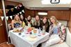 A group of girls celebrating a birthday on the Private Sailboat Charter to the Statue of Liberty and NYC.