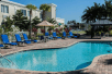 Outdoor pool with sun loungers at Quality Inn & Suites Near Fairgrounds & Ybor City.