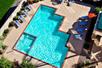 Outdoor pool with sun loungers at Radisson Hotel Phoenix Airport, AZ.