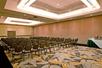 A spacious and carpeted meeting facility.