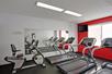 Fitness room with treadmills and other cardio equipment.