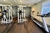 Fitness facility with gym equipment.