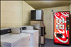 Guest laundry area with ice and beverage machines.