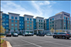 Hotel exterior with parking spaces.