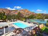 Riviera Oaks Resort's outdoor pool and tennis courts with a gorgeous view of the valley/hills.