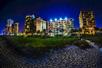 Night view of Sandcastle Oceanfront Resort at The Pavilion in Myrtle Beach.
