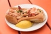 A lobster roll sandwich on the Secret Food Tour Boston in Boston, MA