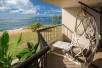 Private lanai with a hanging chair and view of the gorgeous beach.