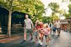 Families walking and having fun on a sunny day at Silver Dollar City in Branson, Missouri.