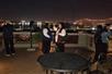 Guests take photos of their surroundings on a Patio in New Orleans while on the Sinister Criminal Intentions True Crime Murder Tour.