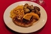 Plant based chicken topped with brown sugar bourbon sauce with roasted potatoes and vegetable of the day for the Veggie Meal at Sleuths Mystery Dinner Shows.
