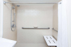 Accessible shower inside a private bathroom.