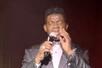 Wearing a tuxedo, Anthony Baily sings in Pigeon Forge, TN