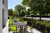 Patio with tables and chairs at SpringHill Suites Richmond North / Glen Allen