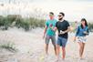 Three people bocce ball game on the beach in St. Augustine, Florida.