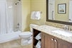 Guest bathroom with bathtub and shower combination.
