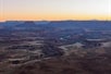 The sun almost completely behind the canyons on the Sunset Flight Canyonlands National Park Tour in Moab Utah, USA.