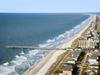 Aerial view of the pier at Surfside Beach Resort and Surfside Beach.