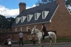 A Thomas Jefferson actor riding a horse