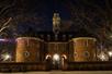 The front of  the Governors Palace at night with the lights on outside.