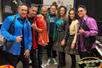 The cast of the THE JETS 80's & 90's Experience! in costume back stage posing for a photo together.
