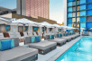 Outdoor pool with cabanas.