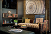 Lobby with soft seating, books, and flat-screen TV.