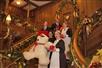 Staff members on the Grand Staircase decorated for Christmas at the Titanic Museum Attraction in Branson.