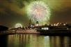 The USS Midway with fireworks in the background in San Diego, CA.