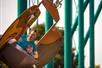 A father and son laughing while riding the Flying Eagles at Valleyfair in Bloomington, Minnesota.