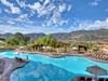 Outdoor pool with sun loungers and cabanas with a gorgeous view of the hills of Escondido at Hyatt Vacation Club at The Welk in Escondido, CA.
