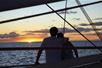 Catch the sunset while in a cruise in West Oahu