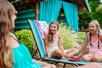 Young girls lounging and laughing near the cabanas at White Water in Branson, Missouri.