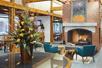 Cozy lobby featuring a warm fireplace, perfect for relaxing and unwinding.