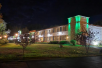 Hotel exterior at night.