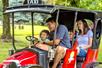 A family having fun while riding Le TaxiTour at Worlds of Fun amusement park in Kansas City, Missouri.