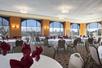 Meeting/Banquet facility with large windows and ample seating.