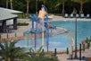 Outdoor pool area with kids' splash zone.