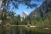 A lake that backs into the mountains on the Yosemite in Day Tour from San Francisco California, USA.