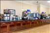 Breakfast area with a selection of cereals, yogurts, juices, and more.