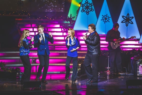 Brett Family singing a Christmas song on stage in Branson, MO.