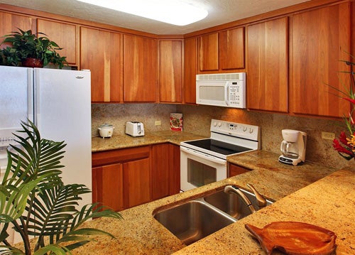 Kitchen, stovetop, refrigerator, microwave at Aston Kona by the Sea, HI.