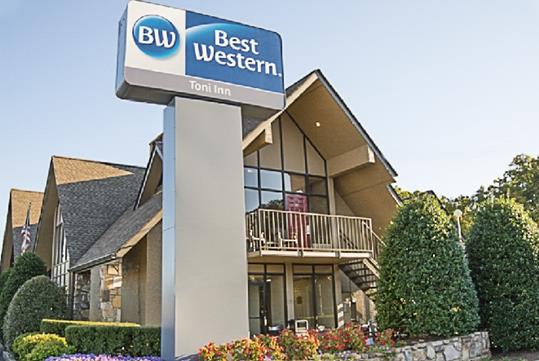 Exterior of the Best Western Toni Inn on a sunny day in Pigeon Forge, Tennessee.