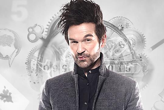 Colin Cloud Show in a grey suit jacket and black shirt at Harrah's Cabaret in Las Vegas.