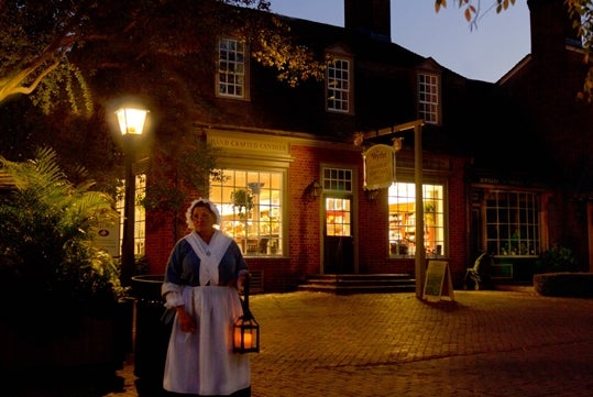 Guide with a lantern during the Colonial Christmas Tour 