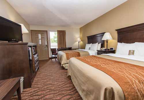 Guest room with two queen beds at Quality Inn West in Branson, Missouri.