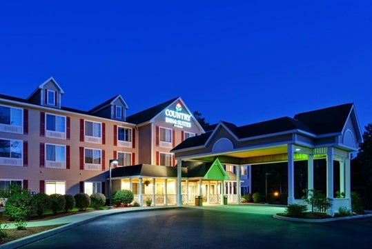 Exterior view of the hotel at night.