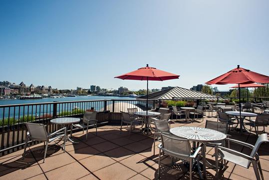 Outdoor patio with waterfront views.