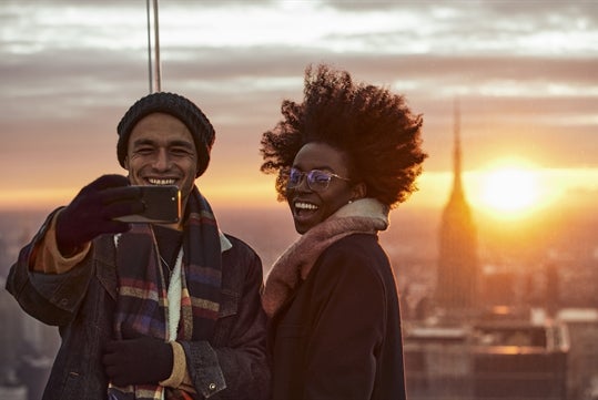 A couple on the sky deck enjoying Edge New York.